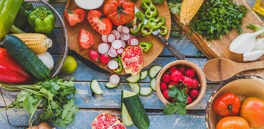 Many Different Fruits & Vegetables Being Cut & Prepared for Meals - Mary's Harvest